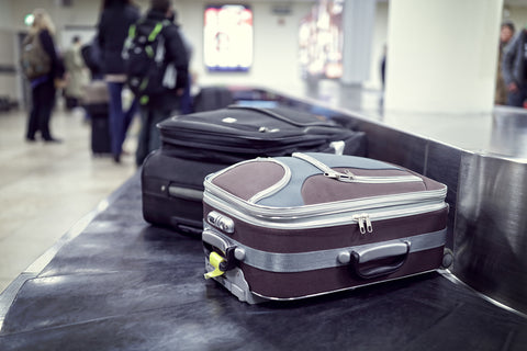 Suitcases on an airport baggage claim belt