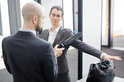 Illustration of a bag being checked at an entrance